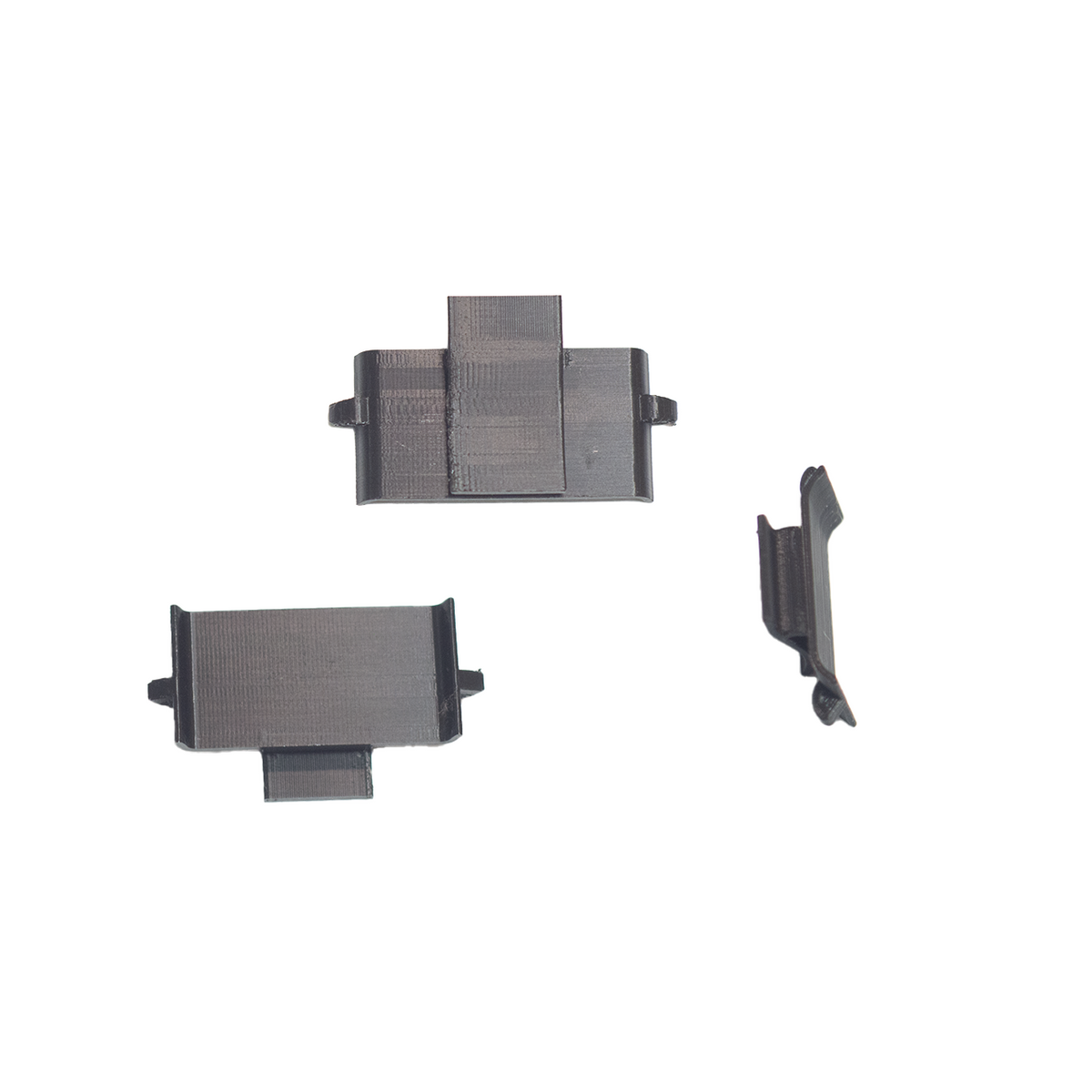 Three small dark gray plastic hardware pieces shown on a plain white background.