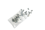 Small rectangular components spilled from a clear plastic bag on a plain white background.