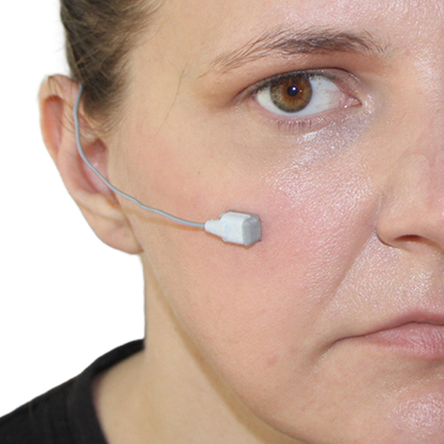 A close-up of a woman's face showing a small white sensor with a thin wire attached to her cheek, against a plain white background.
