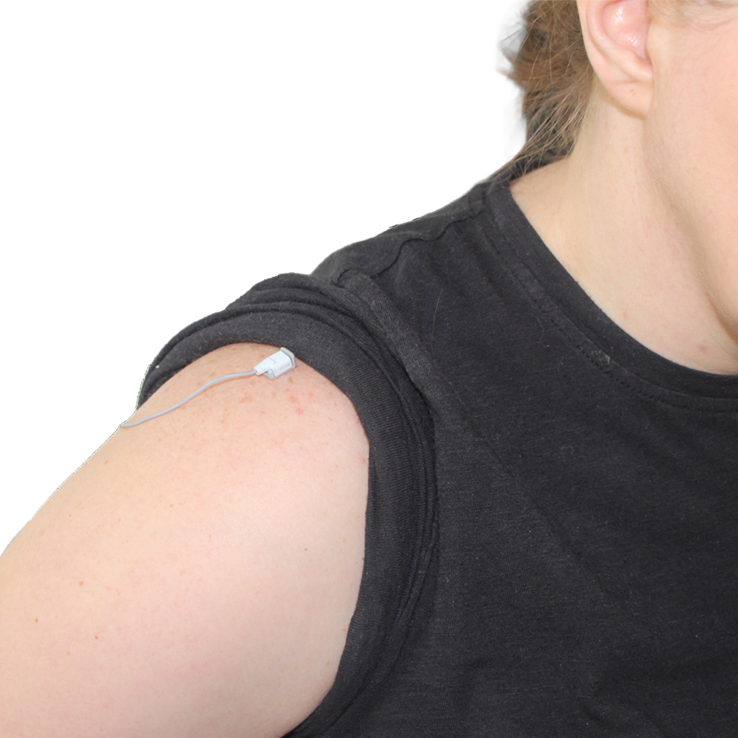 A close-up of a person's upper arm and shoulder wearing a black sleeveless top, with a small white electronic sensor attached to the shoulder.